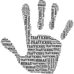 Image of human hand with words human trafficking