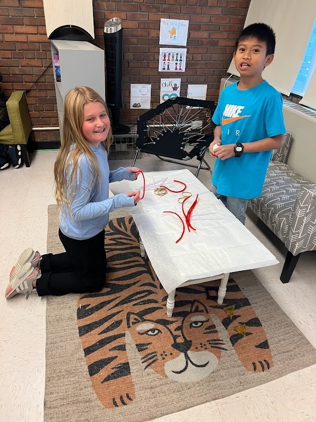  Two students working on a project at table