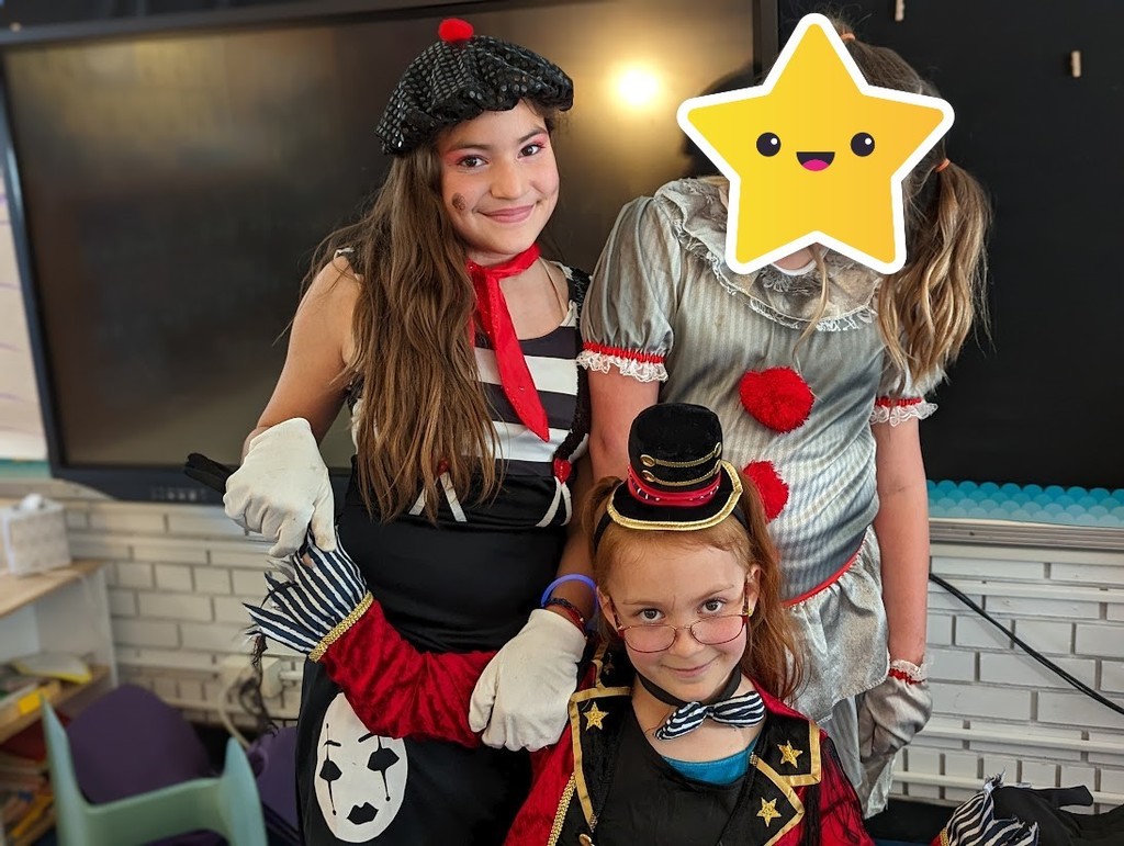  Three students dressed up in costumes taking group picture